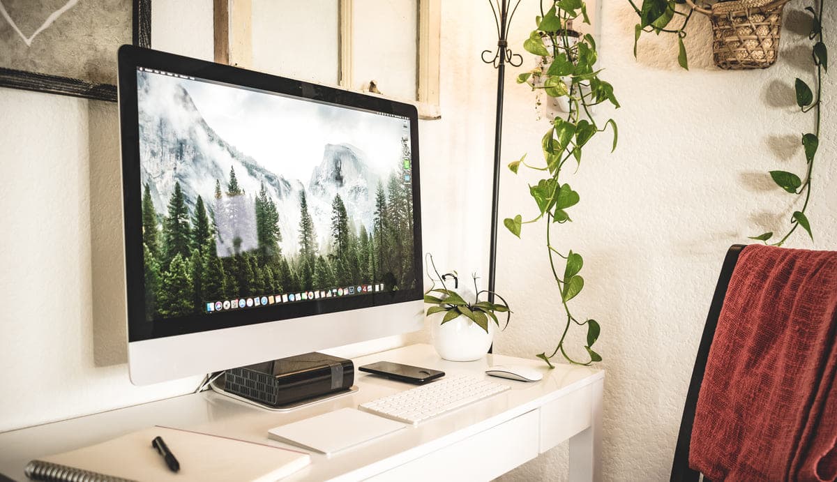 A tidy desk with a desktop computer